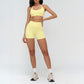 Halter-neck open-back sports bra + high-waisted shorts 2-piece set