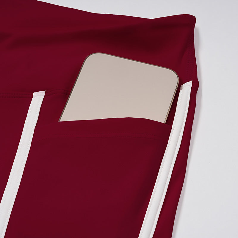 Contrasting color open-back bra + high-waisted contrasting shorts 2-piece set