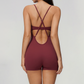 Wholesale Women's Cross-Back Yoga Bodysuit – Brushed Slim Fit Athletic Shorts Jumpsuit w/ Chest Pad
