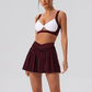 Wholesale Women's Yoga Sports Bra & Pleated Mini Skirt Set with Chest Pad