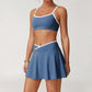 Wholesale sports color-blocked bra + A-line skirt 2-piece set