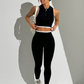 A seamless round neck sleeveless zip bra and sports pants two-piece set