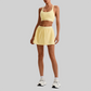 Wholesale Naked-Feel Sports Bra & Pleated Tennis Skirt Set – Quick-Dry Athletic 2-Piece with Built-In Shorts