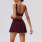 Wholesale Women's Yoga Sports Bra & Pleated Mini Skirt Set with Chest Pad