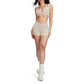 Contrasting color open-back bra + high-waisted contrasting shorts 2-piece set