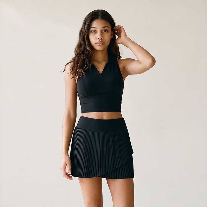 Wholesale Women's Polo Collar Fixed Cup Sports Bra & Anti-Exposure Pleated Skirt Tennis Set