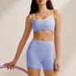 Women's yoga tank top and white-trimmed running shorts two-piece set