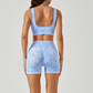 Women's shockproof sports bra and high-waisted running shorts two-piece set.