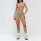 Halter-neck open-back sports bra + high-waisted shorts 2-piece set
