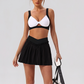 Wholesale Women's Yoga Sports Bra & Pleated Mini Skirt Set with Chest Pad
