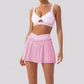 Wholesale Women's Yoga Sports Bra & Pleated Mini Skirt Set with Chest Pad