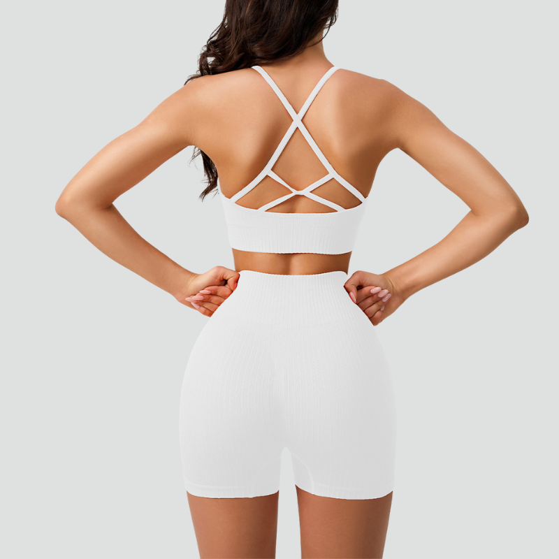 Women's thin strap sports bra and yoga shorts two-piece set.