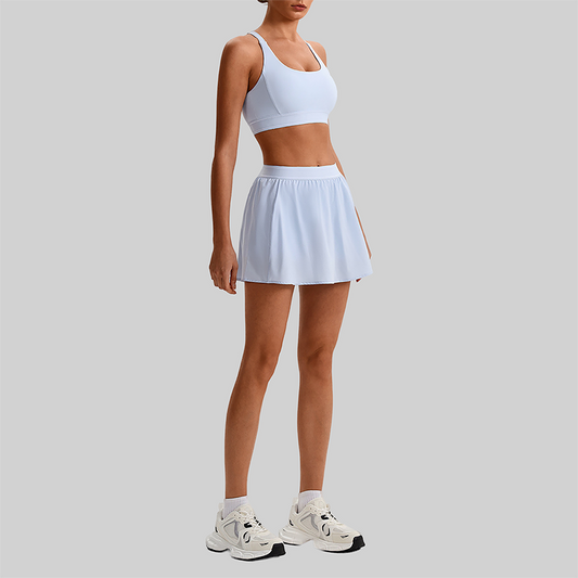 Wholesale Naked-Feel Sports Bra & Pleated Tennis Skirt Set – Quick-Dry Athletic 2-Piece with Built-In Shorts