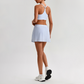 Wholesale Naked-Feel Sports Bra & Pleated Tennis Skirt Set – Quick-Dry Athletic 2-Piece with Built-In Shorts