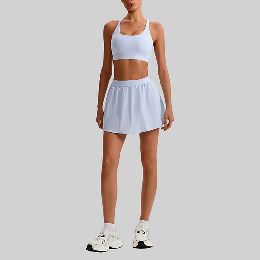Wholesale Naked-Feel Sports Bra & Pleated Tennis Skirt Set – Quick-Dry Athletic 2-Piece with Built-In Shorts