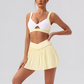 Wholesale Women's Yoga Sports Bra & Pleated Mini Skirt Set with Chest Pad