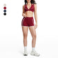 Contrasting color open-back bra + high-waisted contrasting shorts 2-piece set