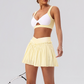 Wholesale Women's Yoga Sports Bra & Pleated Mini Skirt Set with Chest Pad