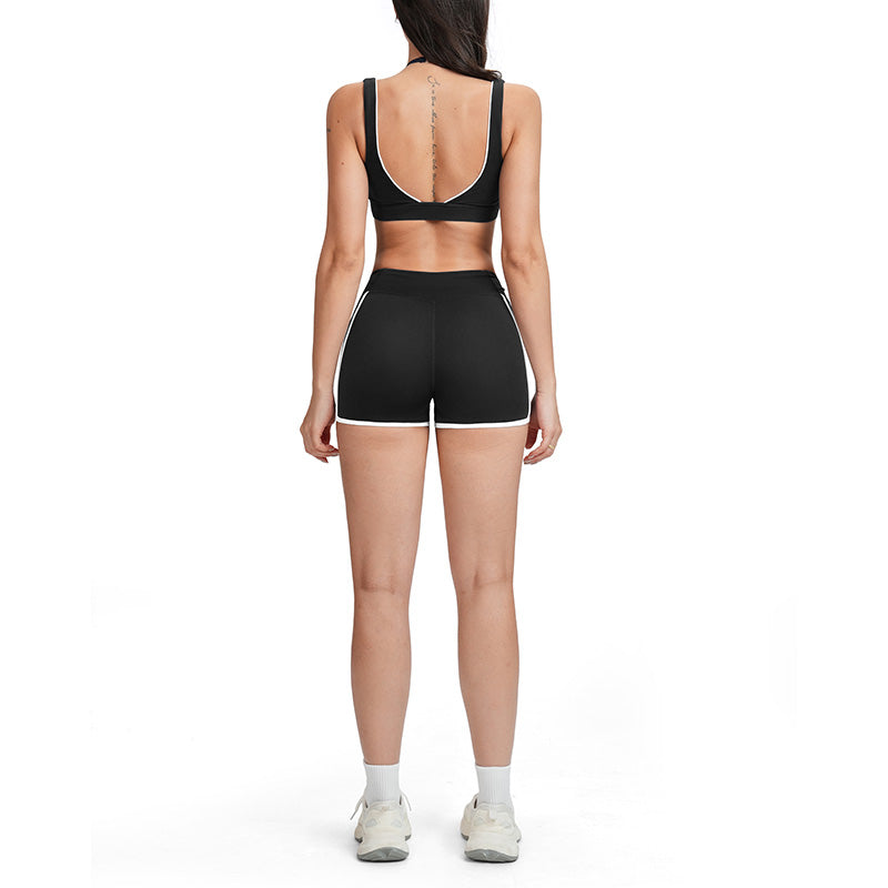 Contrasting color open-back bra + high-waisted contrasting shorts 2-piece set
