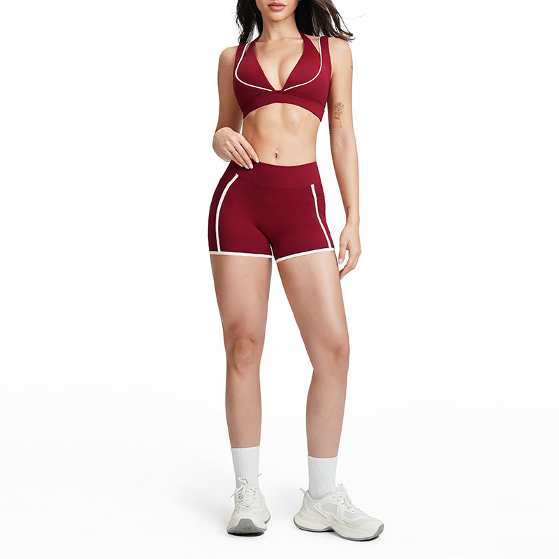 Contrasting color open-back bra + high-waisted contrasting shorts 2-piece set