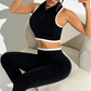 A seamless round neck sleeveless zip bra and sports pants two-piece set