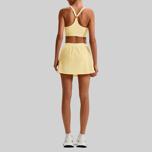 Wholesale Naked-Feel Sports Bra & Pleated Tennis Skirt Set – Quick-Dry Athletic 2-Piece with Built-In Shorts