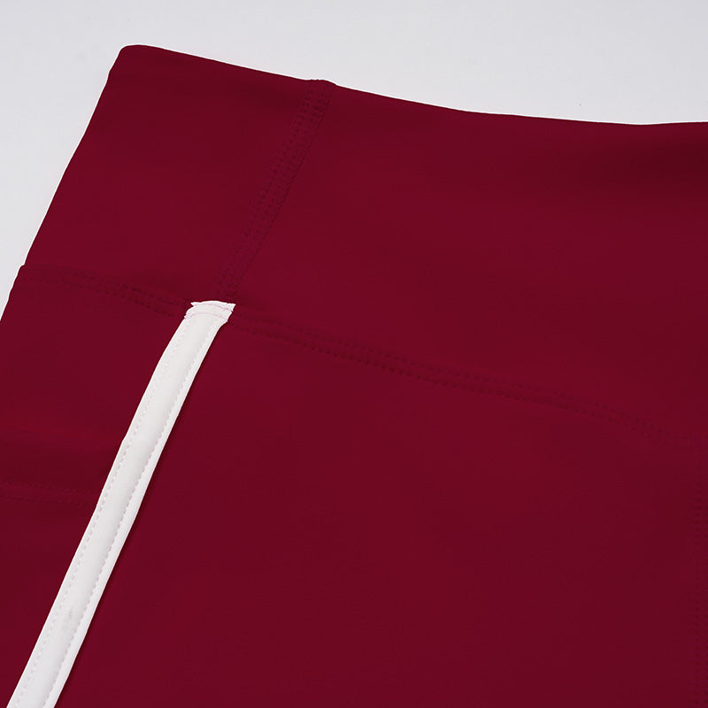 Contrasting color open-back bra + high-waisted contrasting shorts 2-piece set