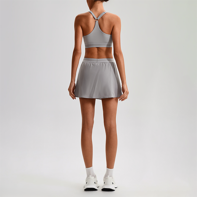 Wholesale Naked-Feel Sports Bra & Pleated Tennis Skirt Set – Quick-Dry Athletic 2-Piece with Built-In Shorts