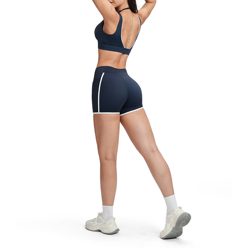 Contrasting color open-back bra + high-waisted contrasting shorts 2-piece set