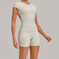 Wholesale Women's Open-Back Pleated Yoga Set Short Sleeve Crop Top & Shorts with Chest Pad