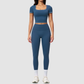 Wholesale Women's Seam-Detail Short Sleeve Crop Top + High-Waist Leggings Set – Butt-Lifting Yoga Gym Activewear