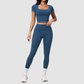 Wholesale Women's Seam-Detail Short Sleeve Crop Top + High-Waist Leggings Set – Butt-Lifting Yoga Gym Activewear