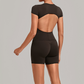 Wholesale Women's Open-Back Pleated Yoga Set Short Sleeve Crop Top & Shorts with Chest Pad