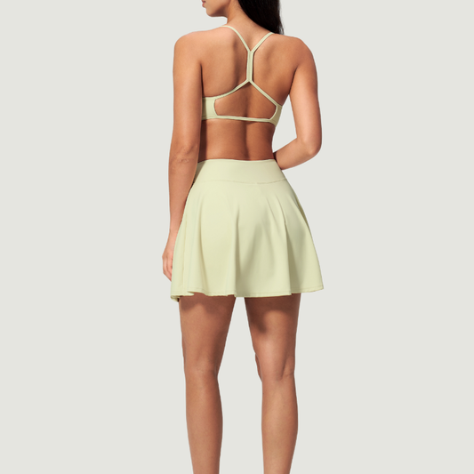 Wholesale Cross Straps Naked-Feel Sports Bra & Pleated Tennis Skirt Set