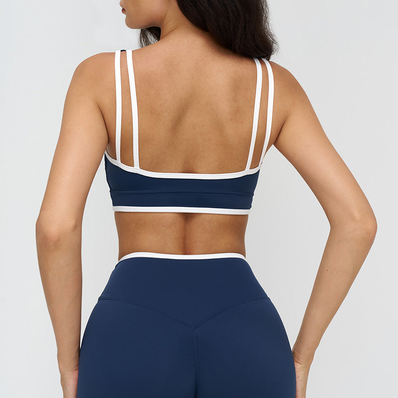 Women's contrasting color sports bra with removable chest pads