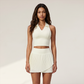Wholesale Women's Polo Collar Fixed Cup Sports Bra & Anti-Exposure Pleated Skirt Tennis Set