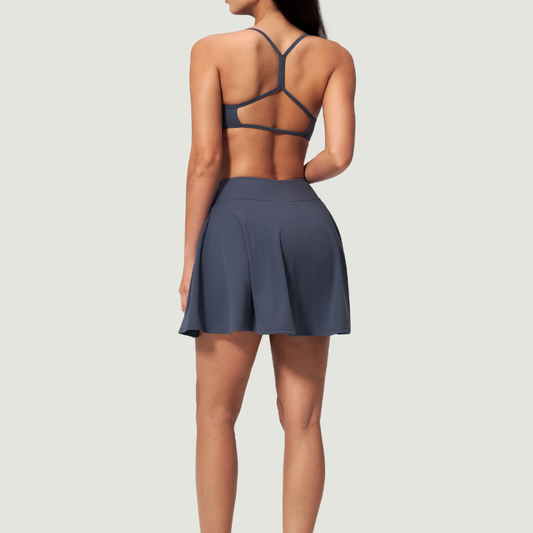 Wholesale Cross Straps Naked-Feel Sports Bra & Pleated Tennis Skirt Set