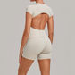Wholesale Women's Open-Back Pleated Yoga Set Short Sleeve Crop Top & Shorts with Chest Pad
