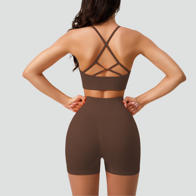 Women's thin strap sports bra and yoga shorts two-piece set.