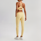 Wholesale Naked-Feel Open-Back Sports Bra & High-Waist Jogger Pants Set – Sculpting Yoga 2-Piece