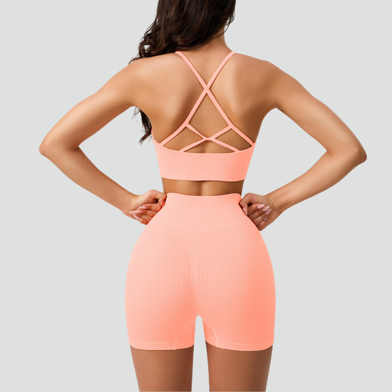 Women's thin strap sports bra and yoga shorts two-piece set.
