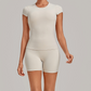 Wholesale Women's Open-Back Pleated Yoga Set Short Sleeve Crop Top & Shorts with Chest Pad