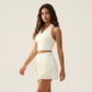 Wholesale Women's Polo Collar Fixed Cup Sports Bra & Anti-Exposure Pleated Skirt Tennis Set