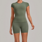 Wholesale Women's Open-Back Pleated Yoga Set Short Sleeve Crop Top & Shorts with Chest Pad