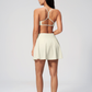 Wholesale Cross Straps Naked-Feel Sports Bra & Pleated Tennis Skirt Set