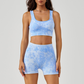 Women's shockproof sports bra and high-waisted running shorts two-piece set.