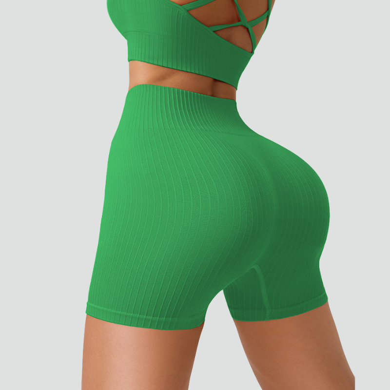 Women's thin strap sports bra and yoga shorts two-piece set.